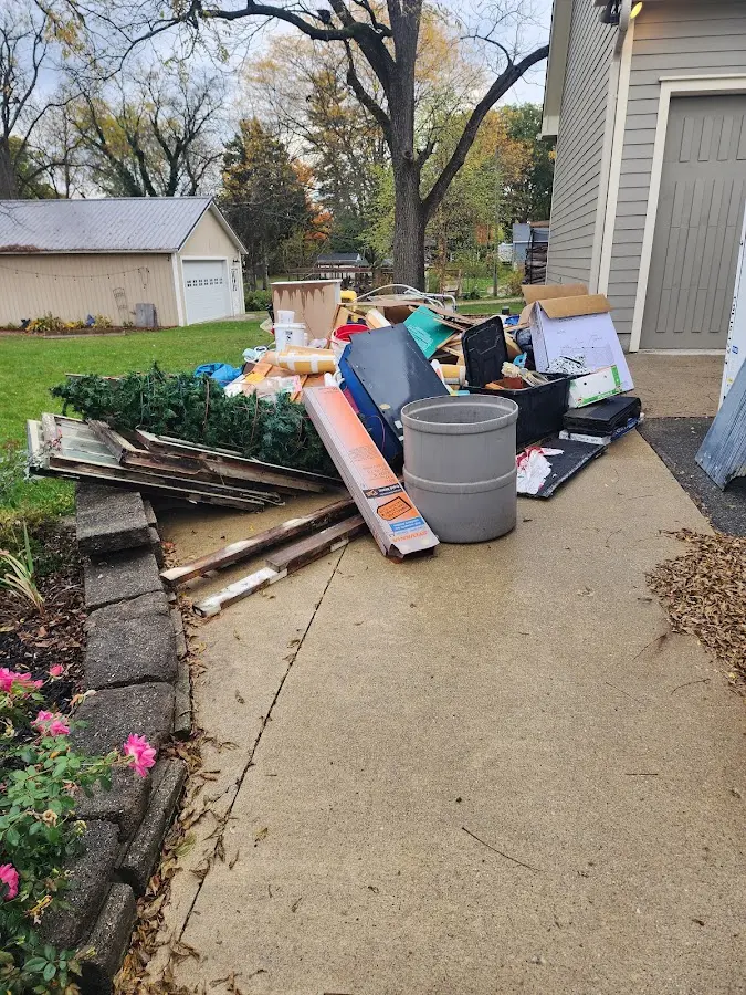 Dumpster being loaded with debris for 30 Yard Dumpster Rental in Merrydale